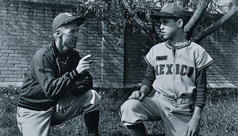 Norman Borlaug and his son Bill, pictured in their Pony League Baseball uniforms, in Mexico