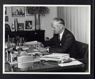 Borlaug at a desk